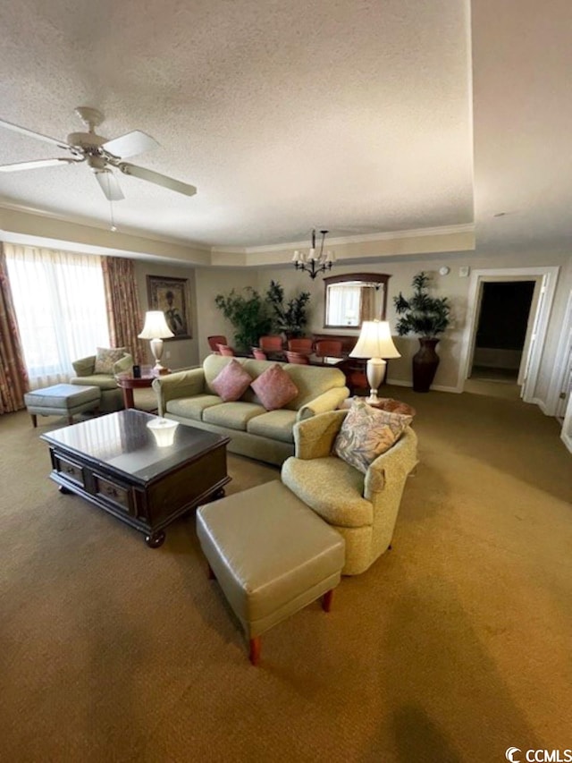 living room with ceiling fan with notable chandelier, carpet, and a textured ceiling