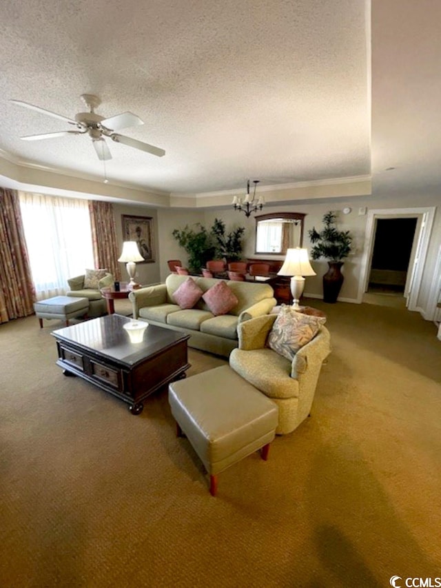 living room featuring ceiling fan, carpet floors, and a textured ceiling