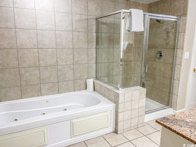 bathroom with separate shower and tub, vanity, and tile flooring