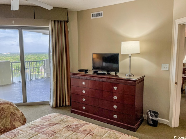 carpeted bedroom featuring access to outside