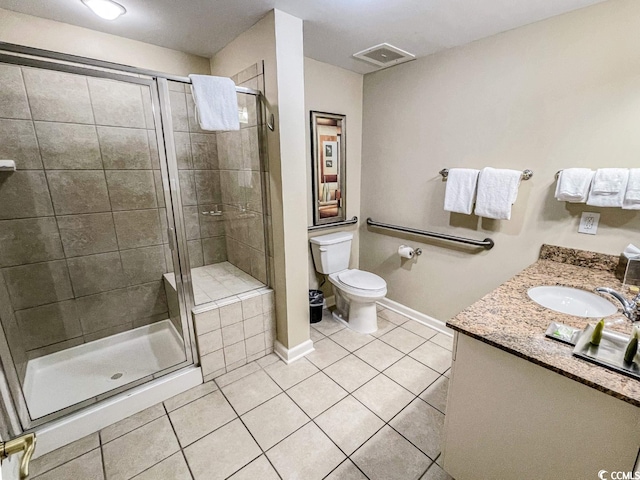 bathroom featuring an enclosed shower, toilet, tile flooring, and vanity