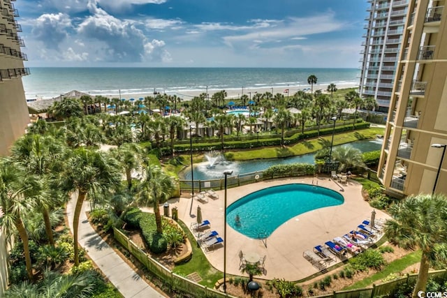 view of pool with a water view