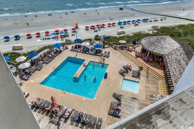 bird's eye view with a view of the beach and a water view