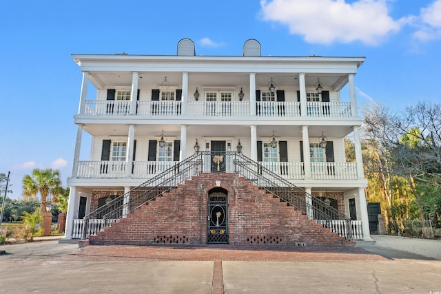101 Greenwich Dr, Georgetown, SC 29440 - greek revival inspired property featuring a porch, stairway, and a balcony