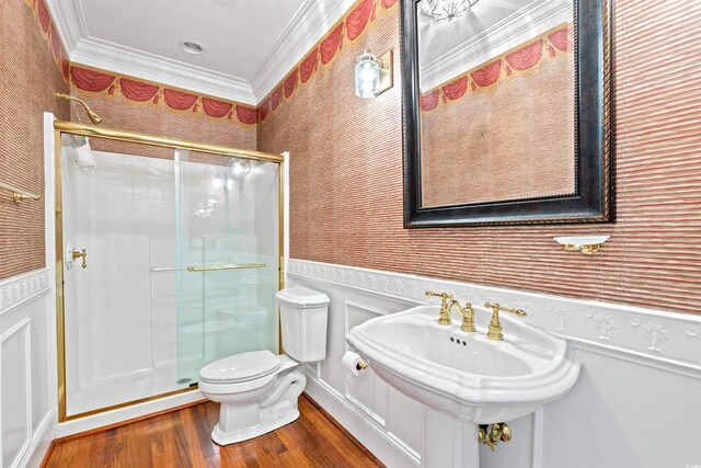 101 Greenwich Dr, Georgetown, SC 29440 - full bath with ornamental molding, a stall shower, wainscoting, wallpapered walls, and wood finished floors