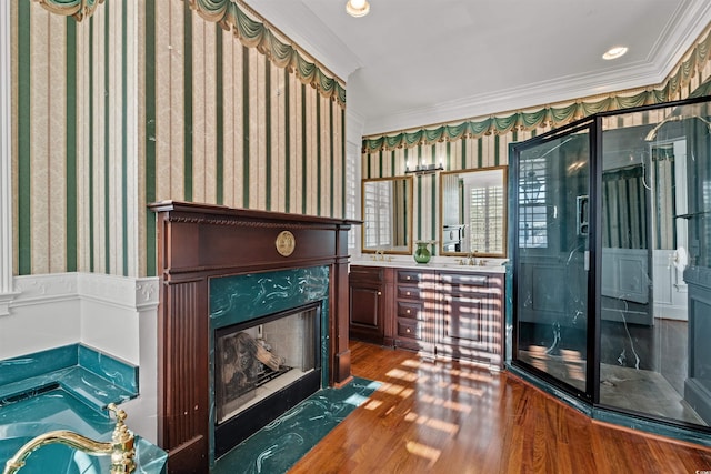 living room featuring crown molding, a fireplace, and dark wood-type flooring