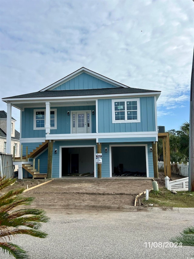 view of front facade with a garage and covered porch