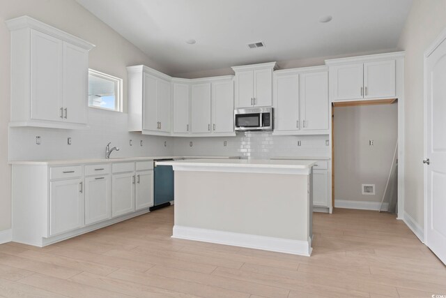 kitchen featuring white cabinets and appliances with stainless steel finishes