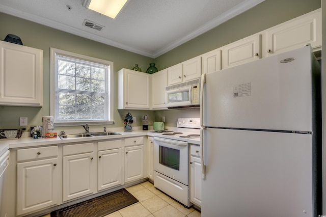 kitchen with sink, light tile patterned flooring, white appliances, white cabinets, and ornamental molding