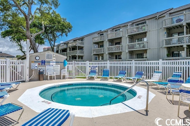 view of swimming pool featuring a patio area