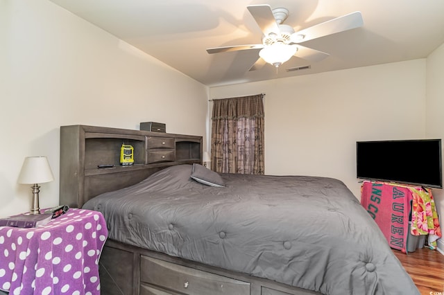 bedroom featuring hardwood / wood-style flooring and ceiling fan