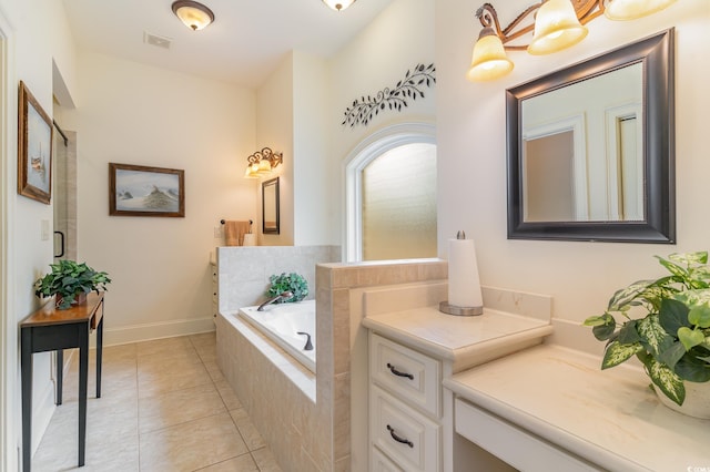 bathroom featuring tile patterned flooring, shower with separate bathtub, and vanity