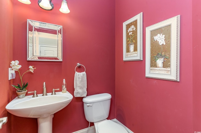 bathroom with sink and toilet