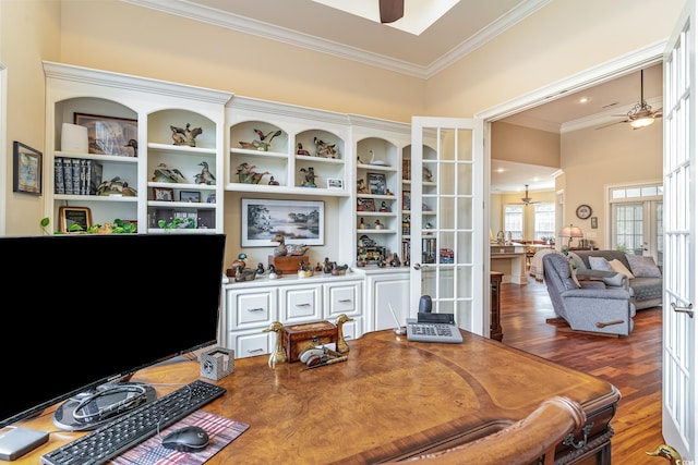 office area with french doors, a towering ceiling, crown molding, and dark wood-type flooring