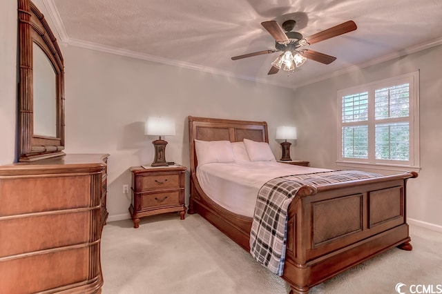 bedroom with ceiling fan, crown molding, and light colored carpet