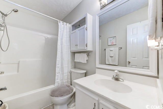 full bathroom with oversized vanity, toilet, shower / tub combo, and a textured ceiling