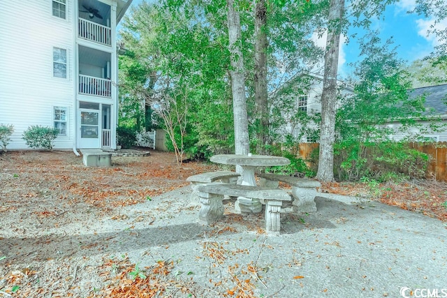 view of yard with a balcony and a patio area