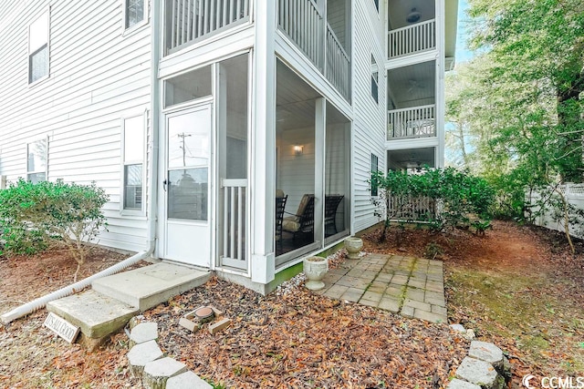 view of side of property with a balcony