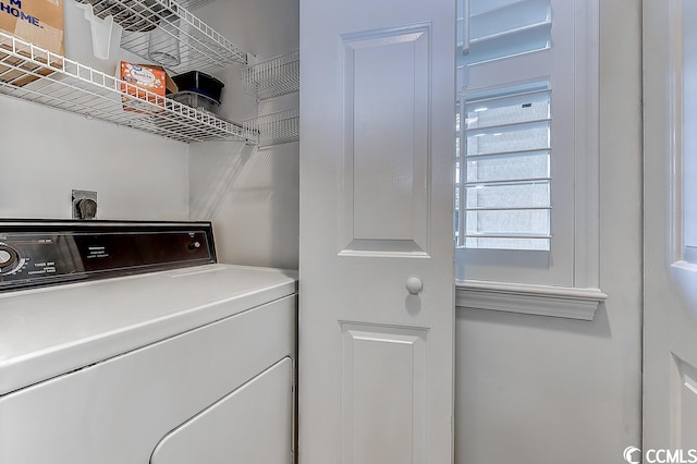 clothes washing area featuring washer / dryer