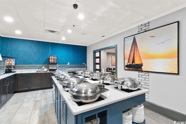 kitchen featuring a center island and light tile flooring