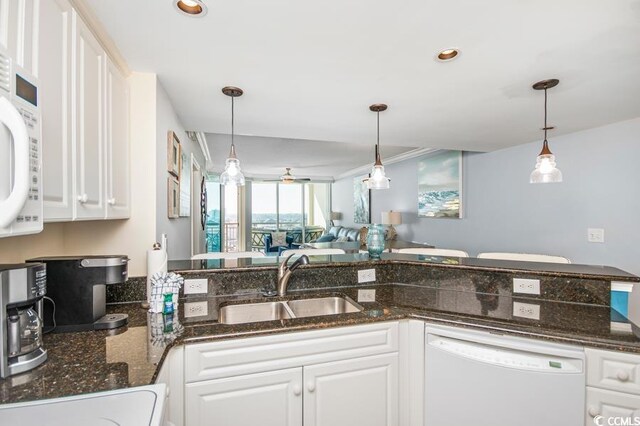 603 S Ocean Blvd Unit 1115, North Myrtle Beach, SC 29582 - kitchen featuring white appliances, a sink, white cabinets, hanging light fixtures, and recessed lighting