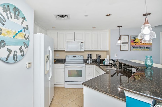 603 S Ocean Blvd Unit 1115, North Myrtle Beach, SC 29582 - kitchen with white appliances, a sink, a peninsula, white cabinets, and recessed lighting