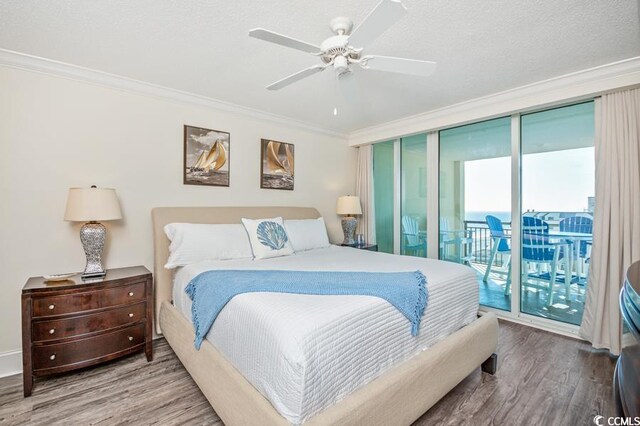 603 S Ocean Blvd Unit 1115, North Myrtle Beach, SC 29582 - bedroom featuring wood finished floors, crown molding, access to outside, and ceiling fan
