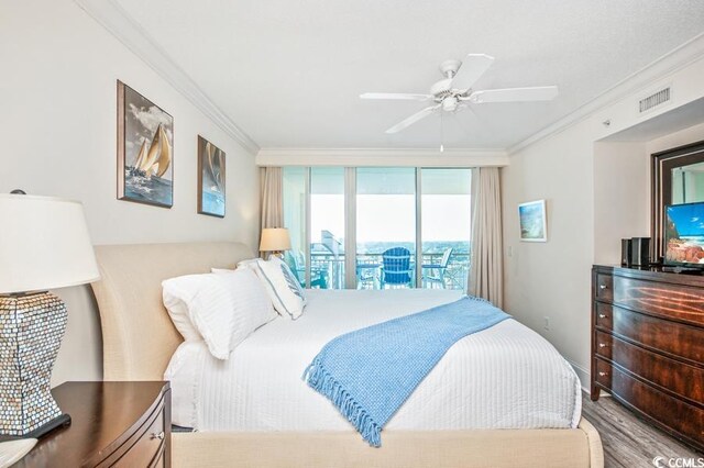 603 S Ocean Blvd Unit 1115, North Myrtle Beach, SC 29582 - bedroom featuring crown molding, wood finished floors, and ceiling fan