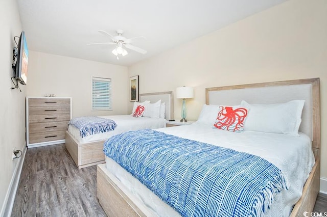 603 S Ocean Blvd Unit 1115, North Myrtle Beach, SC 29582 - bedroom featuring wood finished floors, baseboards, and a ceiling fan