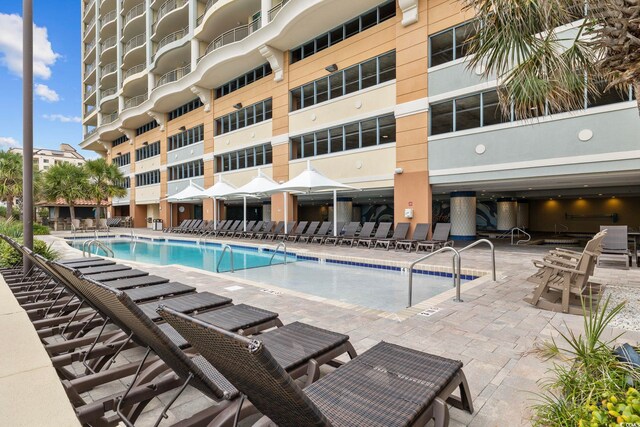 603 S Ocean Blvd Unit 1115, North Myrtle Beach, SC 29582 - community pool with a patio area