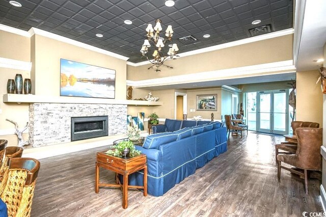 603 S Ocean Blvd Unit 1115, North Myrtle Beach, SC 29582 - living area with crown molding, a chandelier, wood finished floors, a fireplace, and recessed lighting