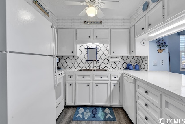 kitchen featuring ceiling fan, white appliances, dark hardwood / wood-style flooring, sink, and white cabinets