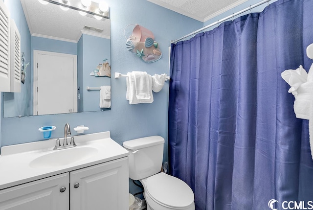 bathroom with toilet, ornamental molding, a textured ceiling, and vanity