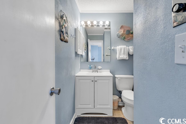 bathroom featuring toilet, ornamental molding, tile flooring, a textured ceiling, and vanity