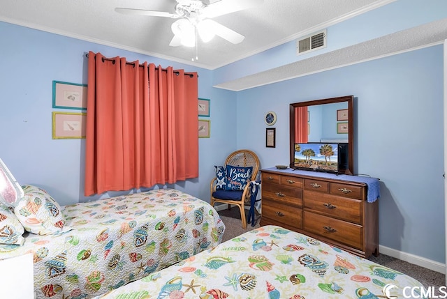 bedroom featuring carpet flooring, a textured ceiling, crown molding, and ceiling fan