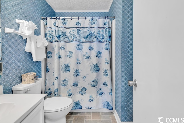 bathroom with vanity, tile floors, a textured ceiling, toilet, and crown molding