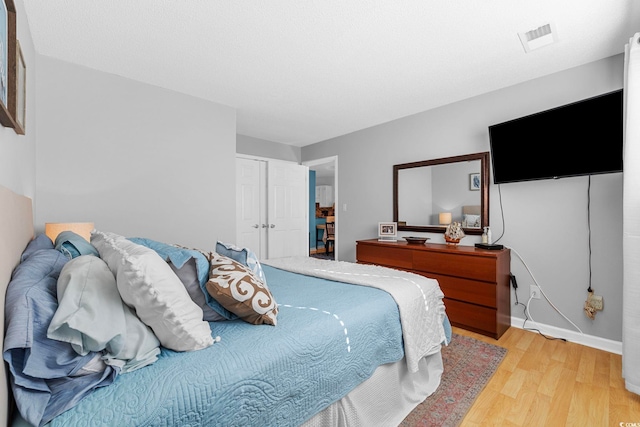 bedroom featuring light wood-type flooring