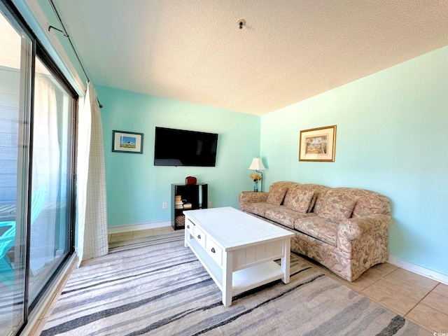 tiled living room with a textured ceiling