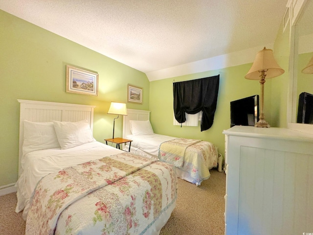 carpeted bedroom featuring lofted ceiling and a textured ceiling