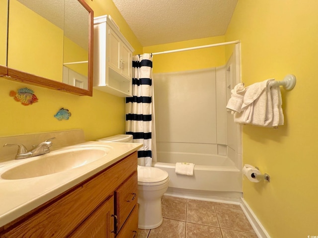 full bathroom with tile floors, a textured ceiling, toilet, shower / bath combo, and vanity with extensive cabinet space