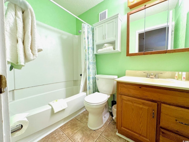 full bathroom with shower / bath combination with curtain, tile floors, a textured ceiling, toilet, and vanity