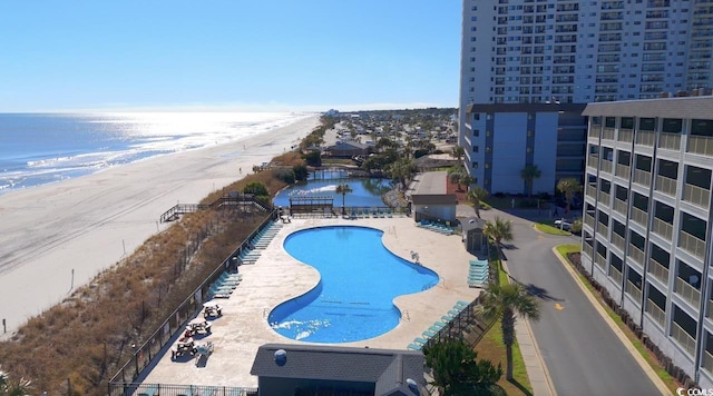 view of swimming pool with a water view