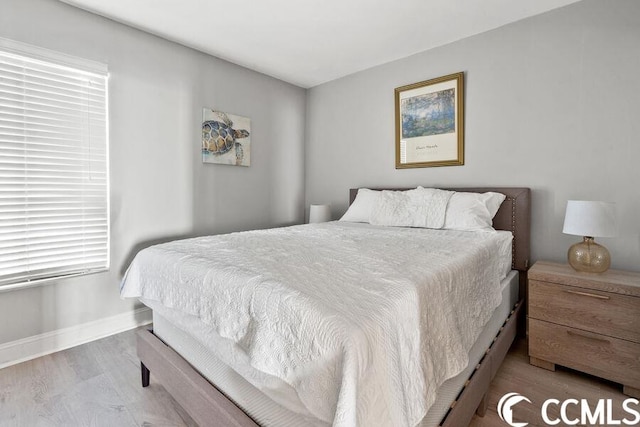 bedroom featuring hardwood / wood-style flooring