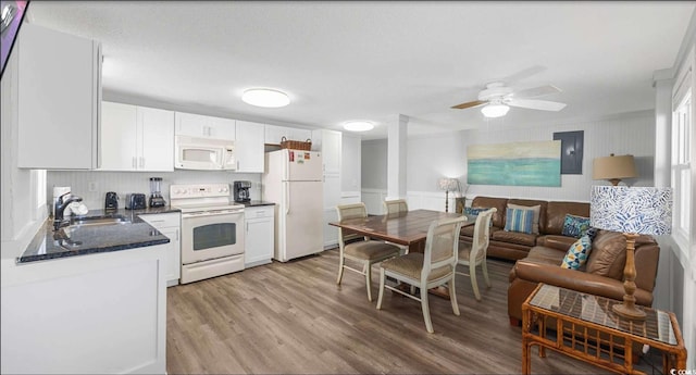 kitchen featuring sink, white appliances, ceiling fan, white cabinetry, and light wood-type flooring