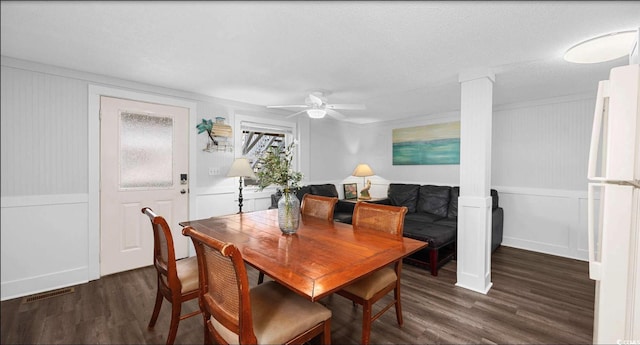 dining room with dark hardwood / wood-style floors and ceiling fan