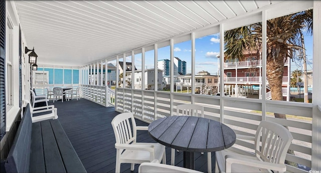 wooden terrace with a water view