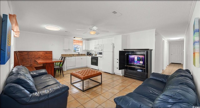 tiled living room featuring sink, crown molding, and ceiling fan