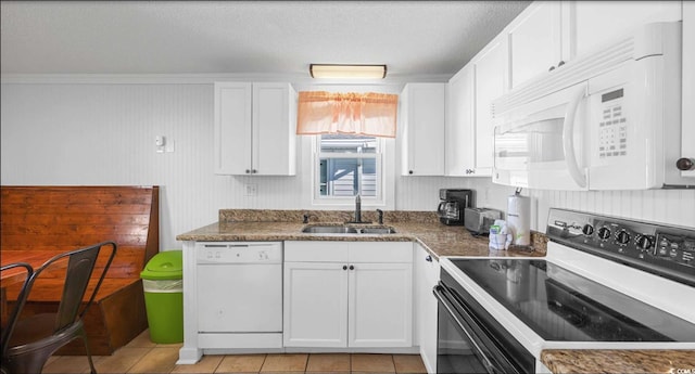 kitchen with white cabinetry, sink, and white appliances