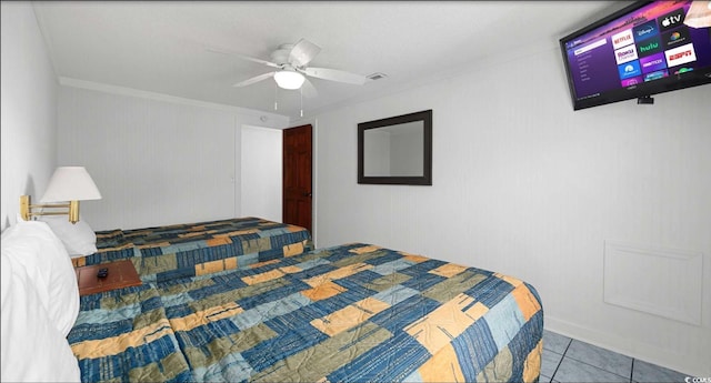 tiled bedroom featuring ceiling fan