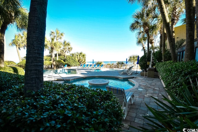 view of swimming pool featuring a patio